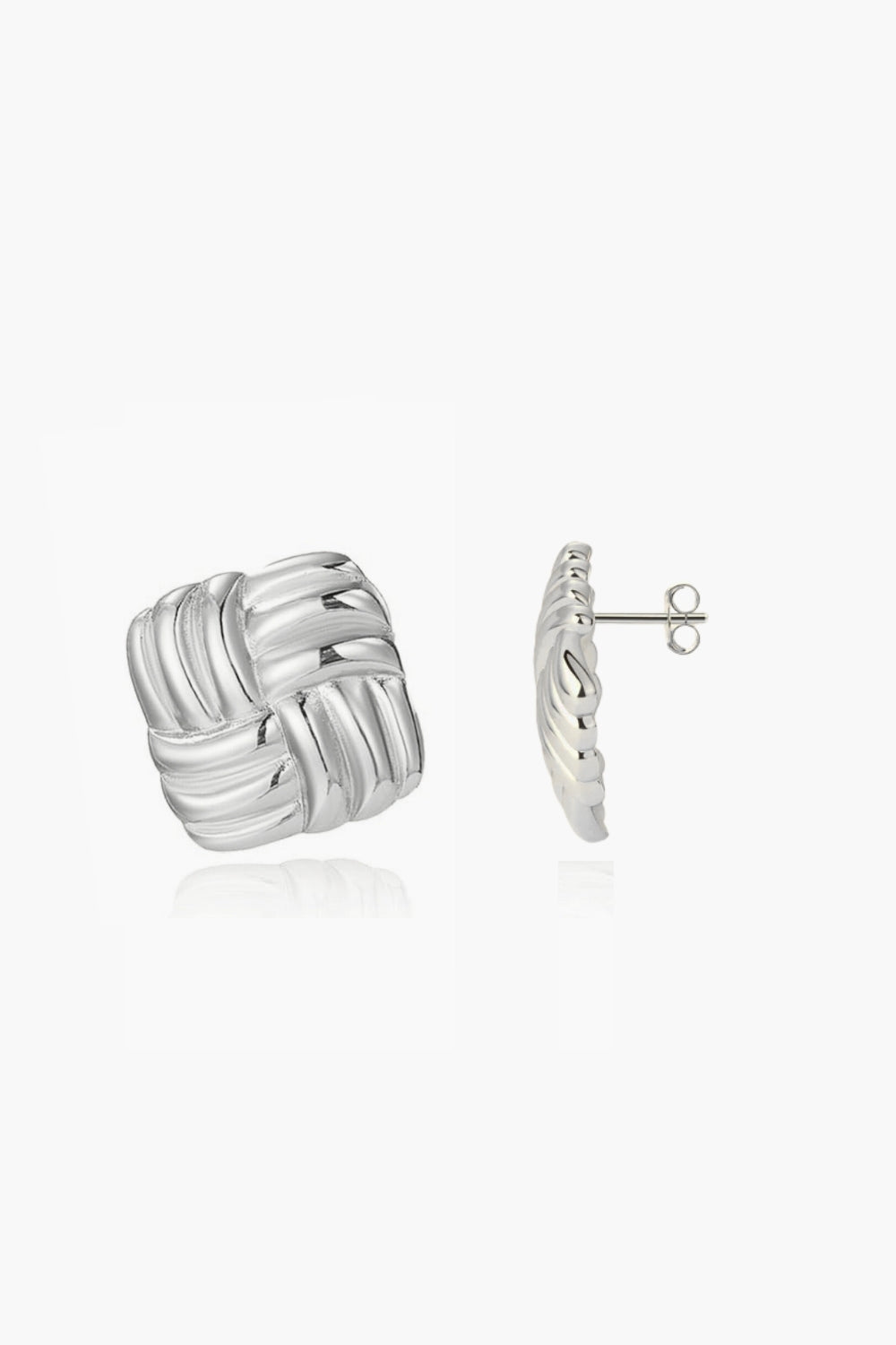 White gold twisted knot earrings on a white background, vintage style.