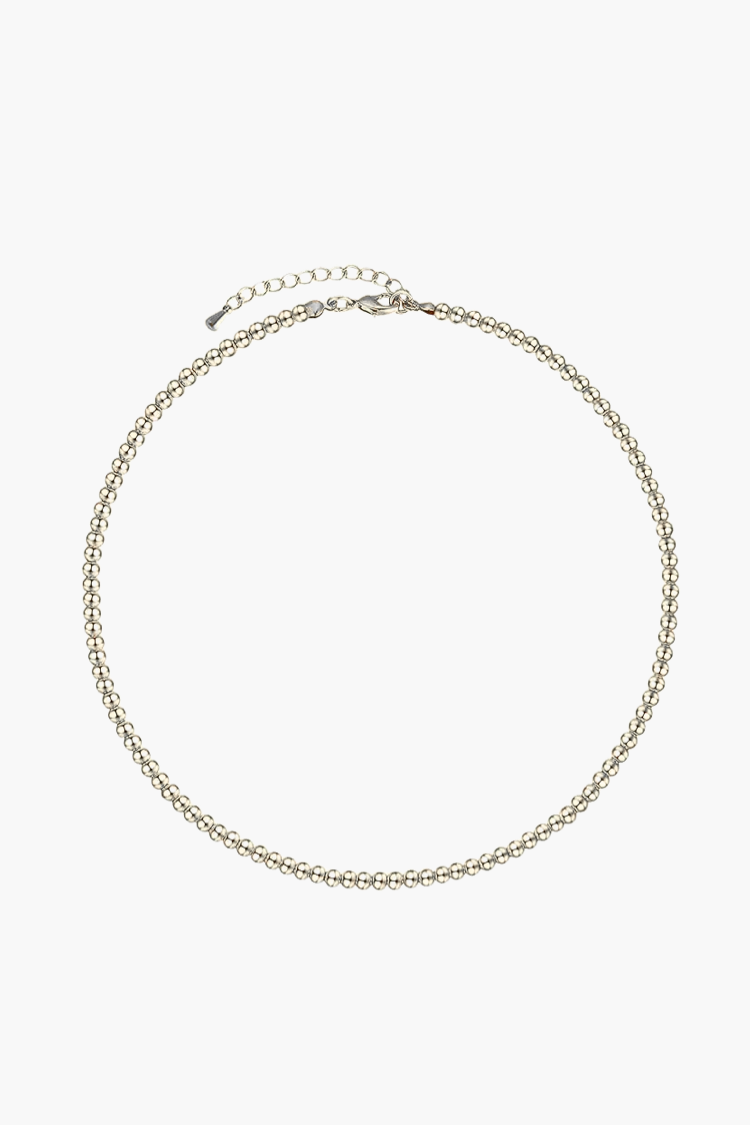 Isla Necklace – delicate 14k white gold-plated beaded chain necklace on white background.