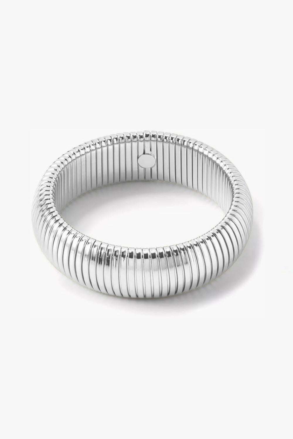 White gold ribbed 20 mm wide bracelet on white background