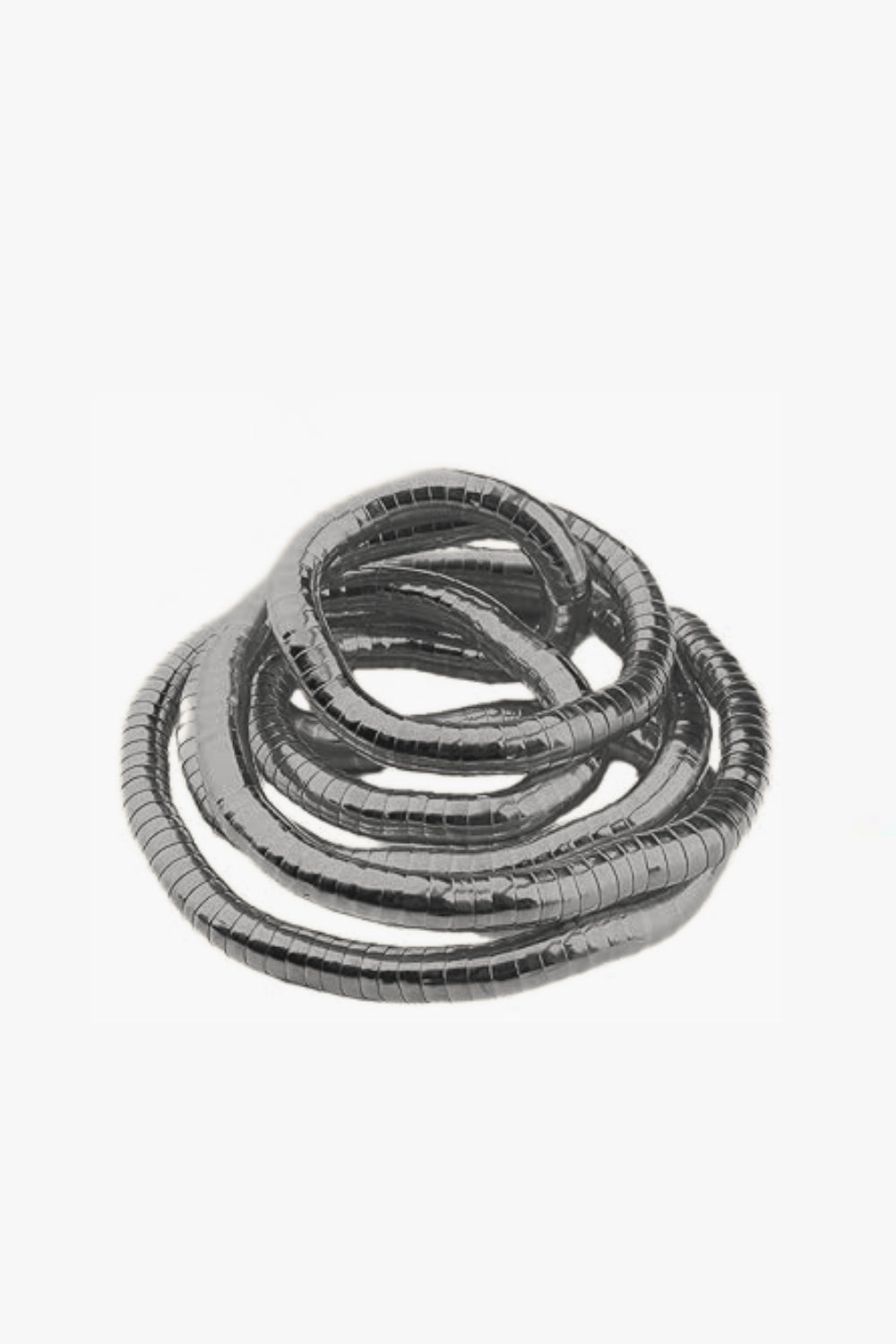 Gunmetal gold adjustable spiral bracelet and necklace on a white background.