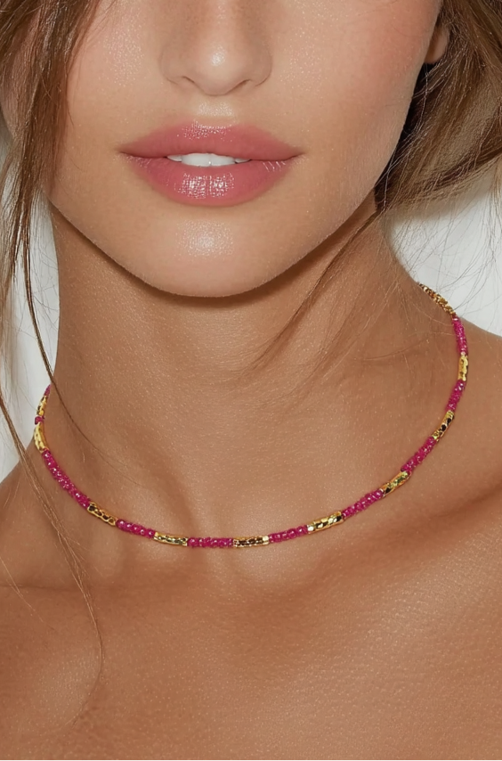 Model wearing the Lucia Necklace Blushing – slim gold-plated necklace with blush pink and rose gemstone beads