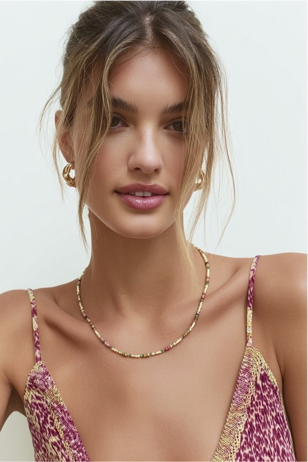 Model wearing the Lucia Necklace Celestial – slim gold-plated necklace with midnight blue and black gemstone beads