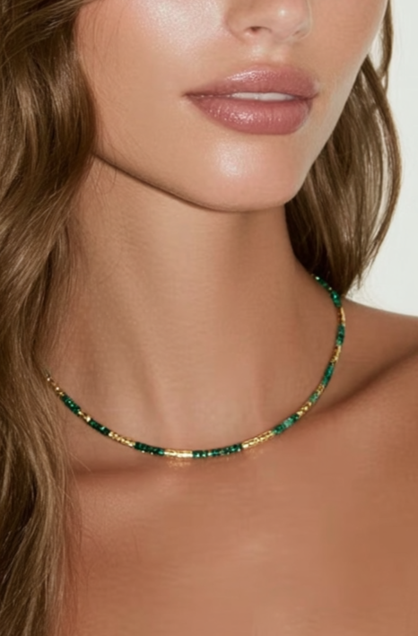 Model wearing the Lucia Necklace Evergreen – slim gold-plated necklace with deep green gemstone beads