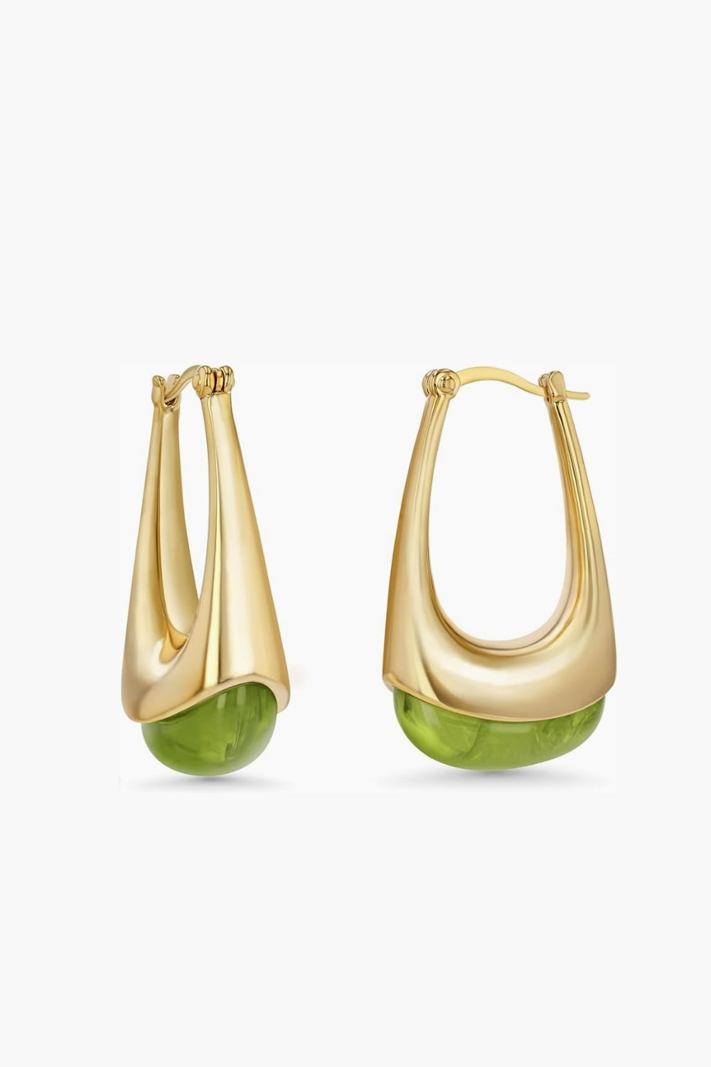 Yellow gold hoop earrings with green stones accent on a white background.