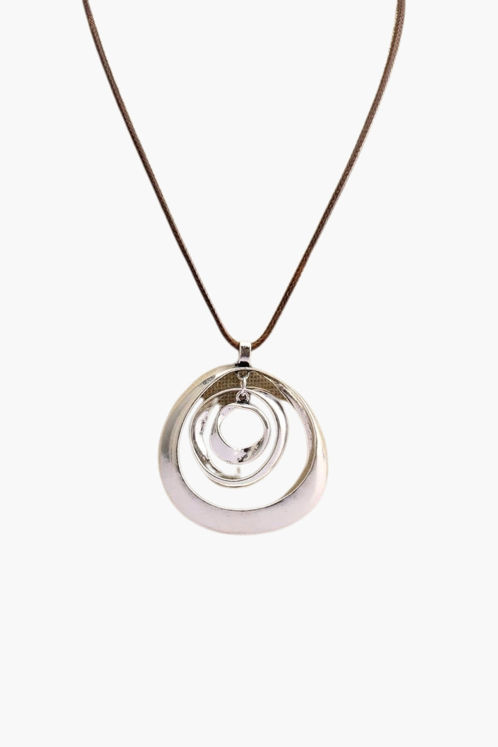 White gold necklace with a circular pendant and brown cord on a white background.