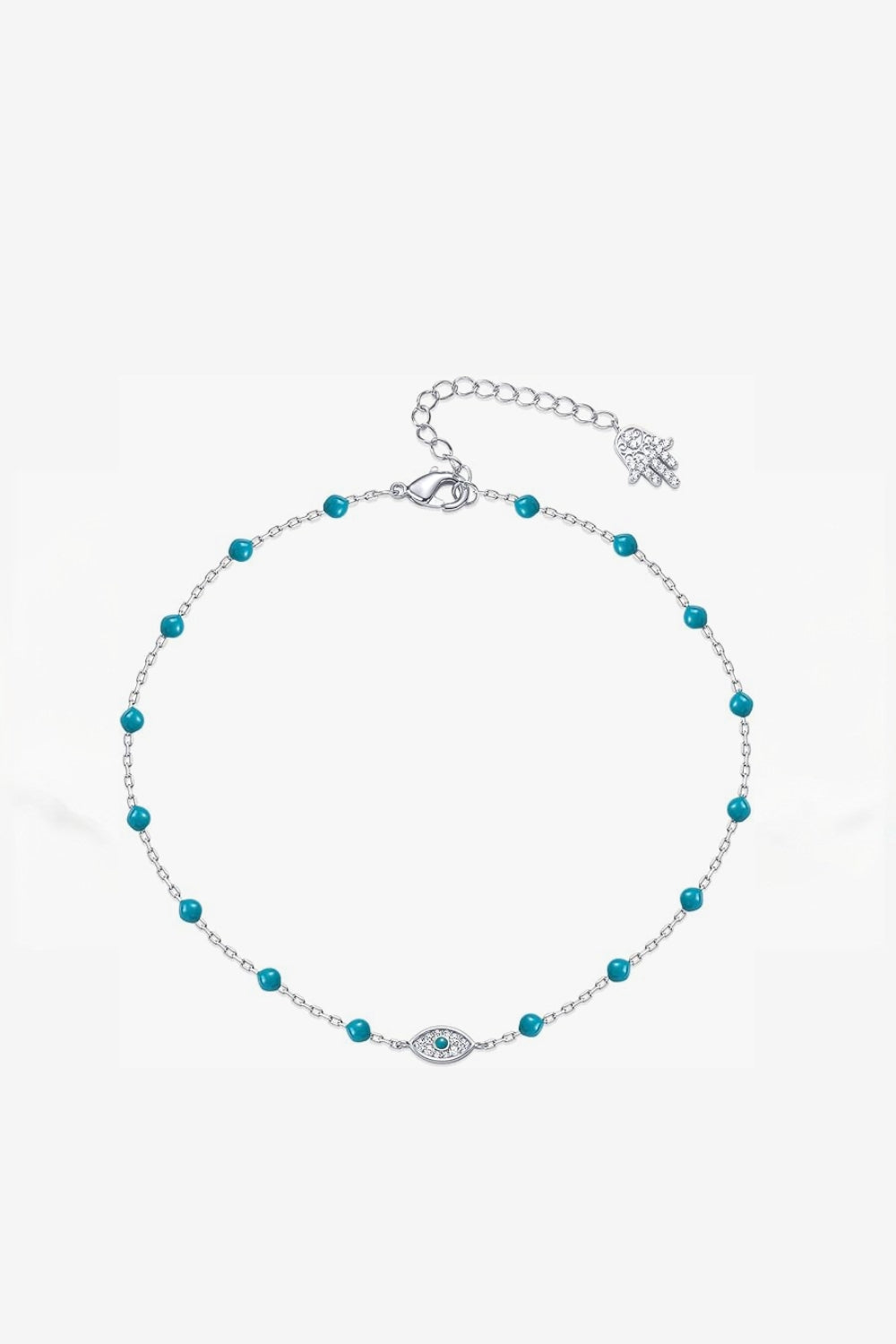 White gold anklet with evil eye and turquoise beads on a white background
