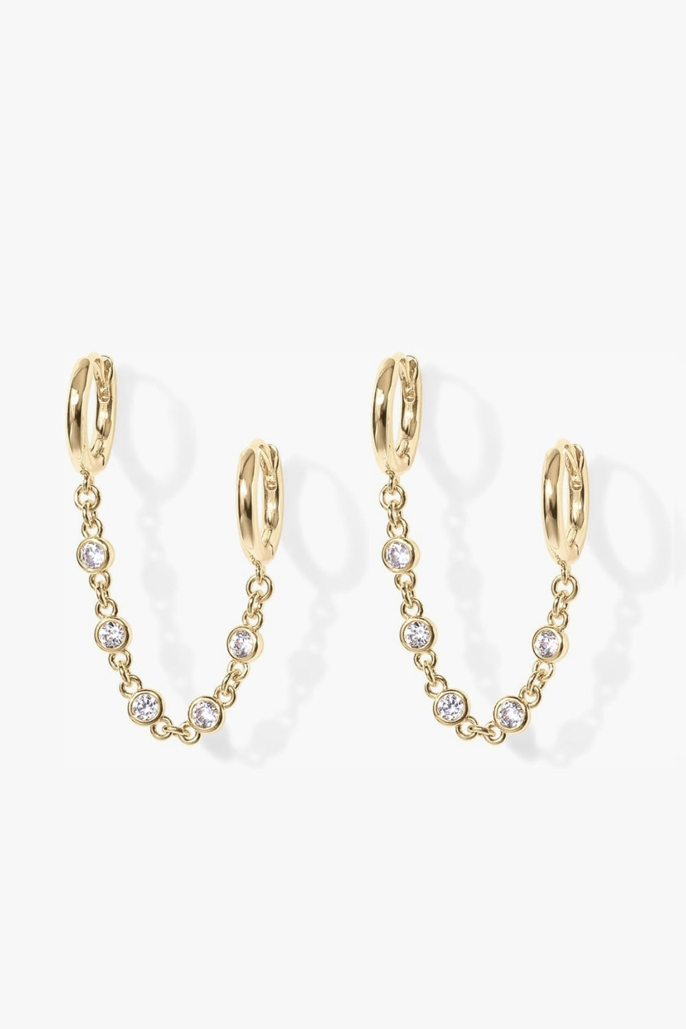 Alexa yellow gold double huggie earrings with bezel stone chain.