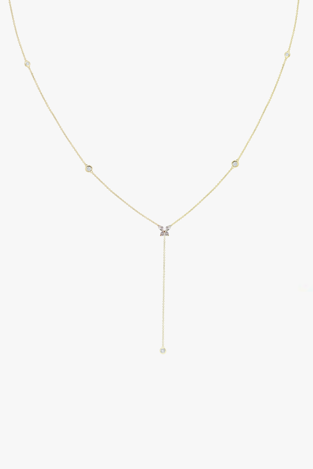 Alice yellow gold butterfly pendant necklace with small diamond bezel design. 