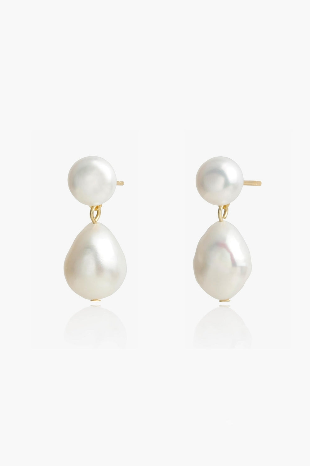Alina Earrings – 18k yellow gold-plated button pearl earrings with natural baroque pearl drop, on white background.