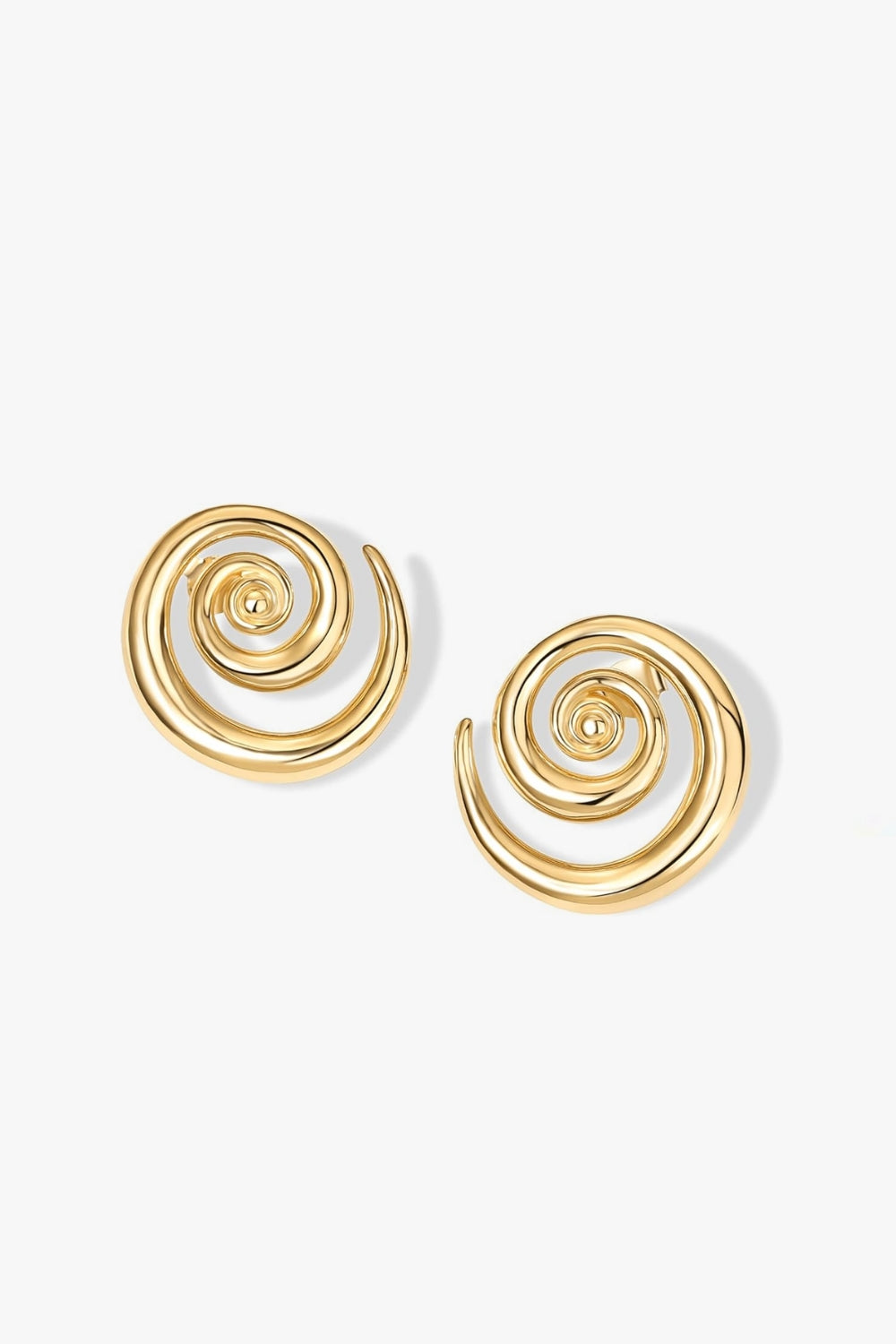 Cleo Earrings – 14k yellow gold-plated chunky hoop earrings with spiral design, on white background.