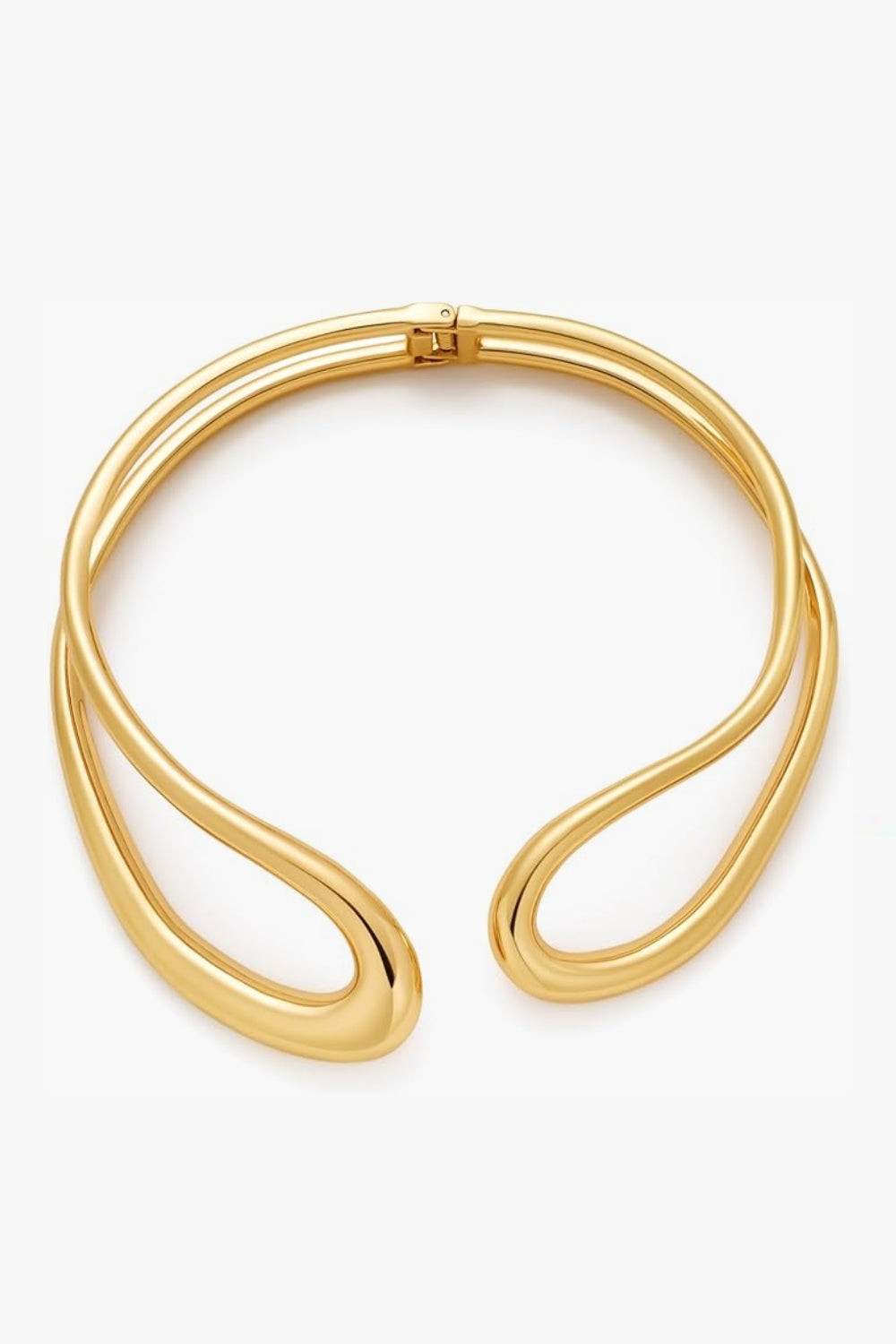 yellow gold sculptural neckpiece, abstract, open collar on a white background.