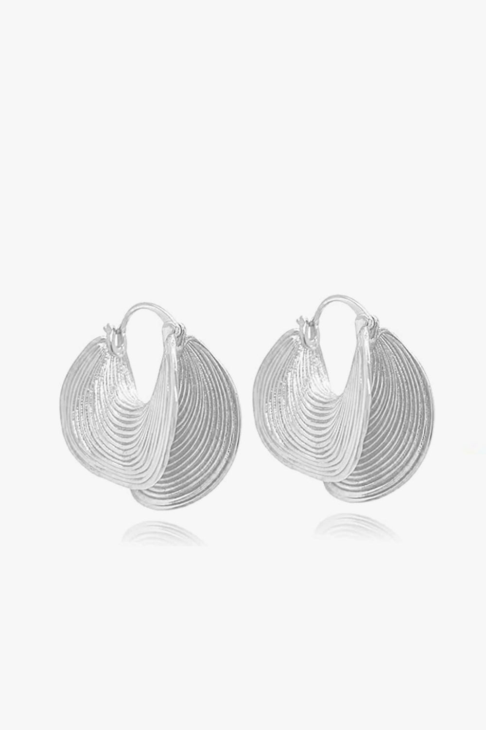 Elara Earrings – 14k white gold-plated textured fan-shaped earrings, on white background.