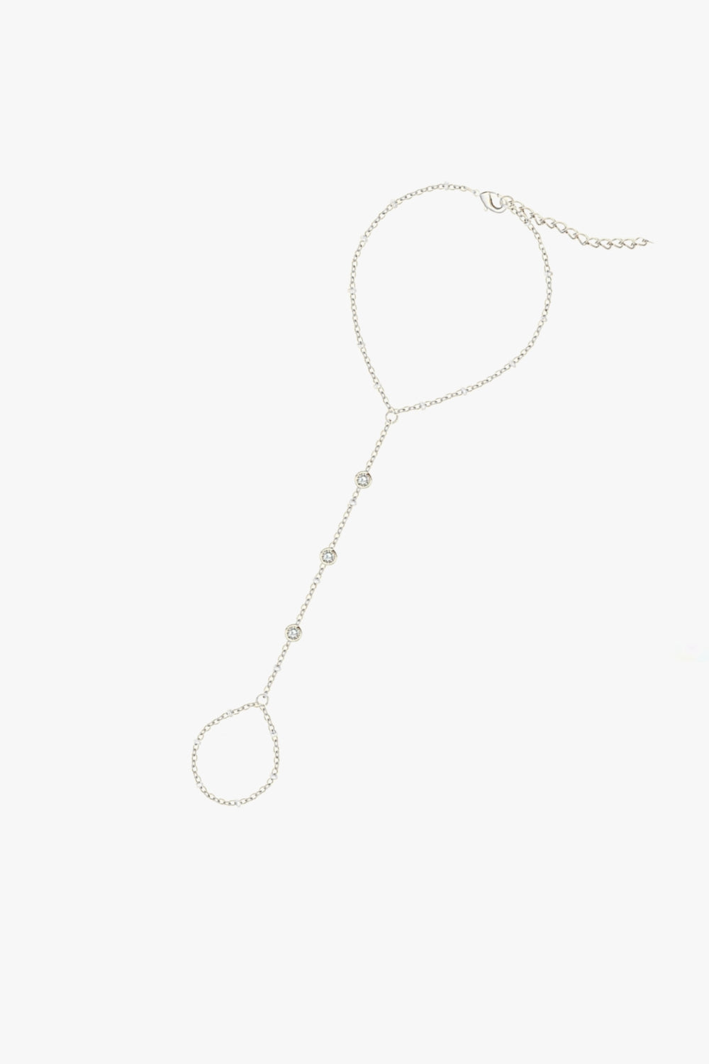 Gaby hand chain bracelet in white gold with three bezel-set stones, finger loop and delicate adjustable chain.