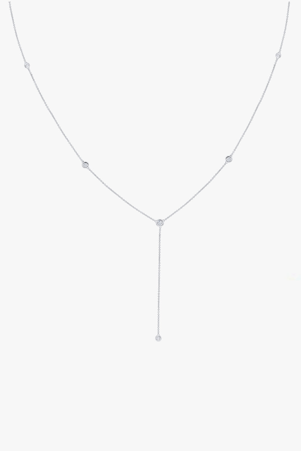 Gaby white gold y-shaped necklace with five bezel set stones and lariat drop.