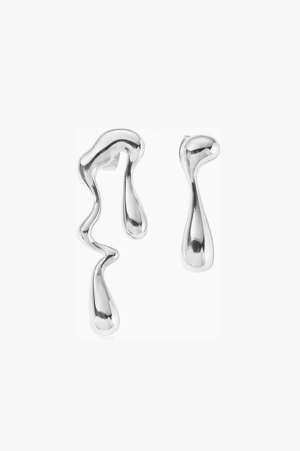 white gold abstract mismatched long earrings on white background, irregular shape