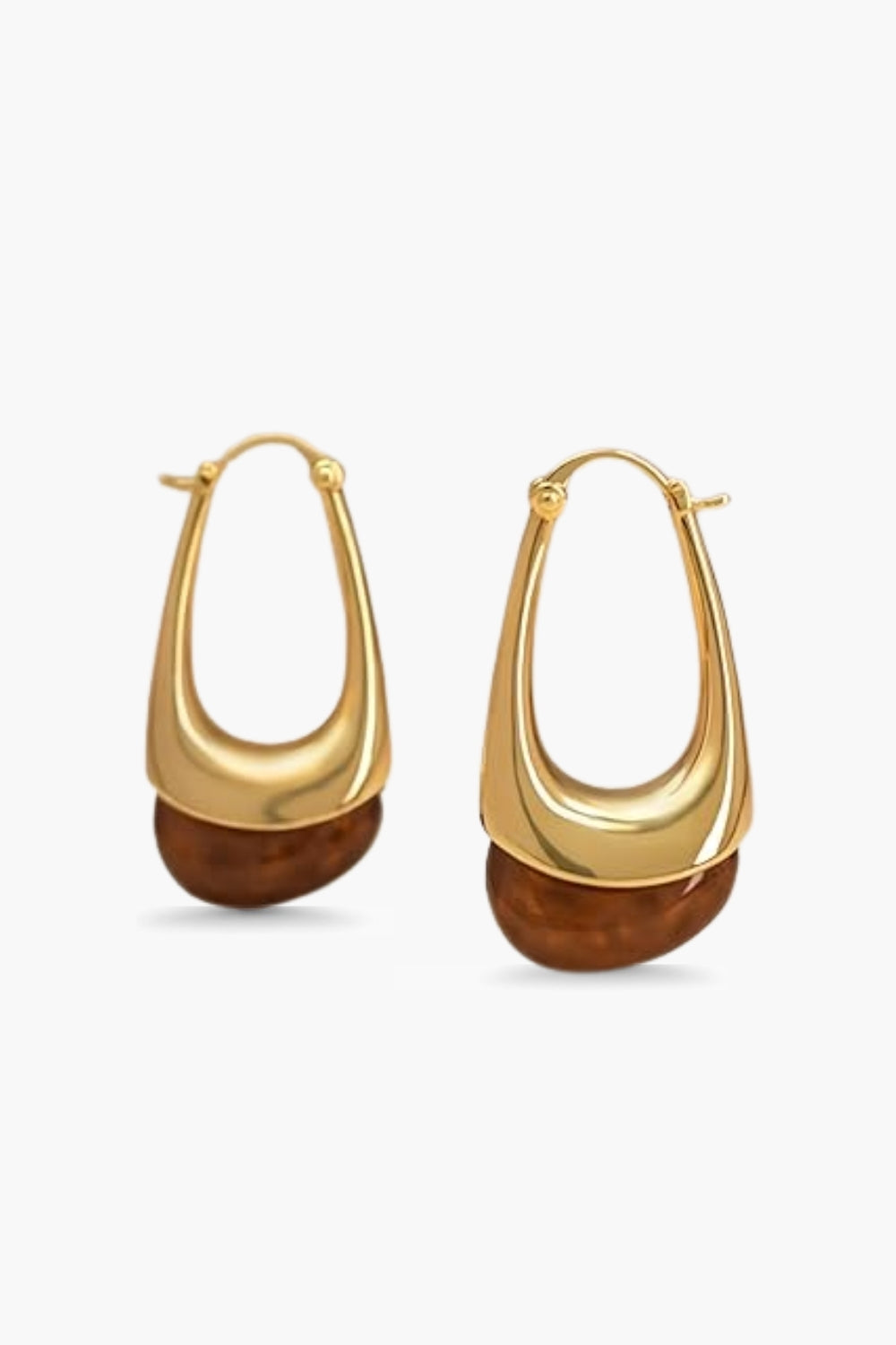 Yellow gold hoop earrings with brown stone bottom accent on a white background.