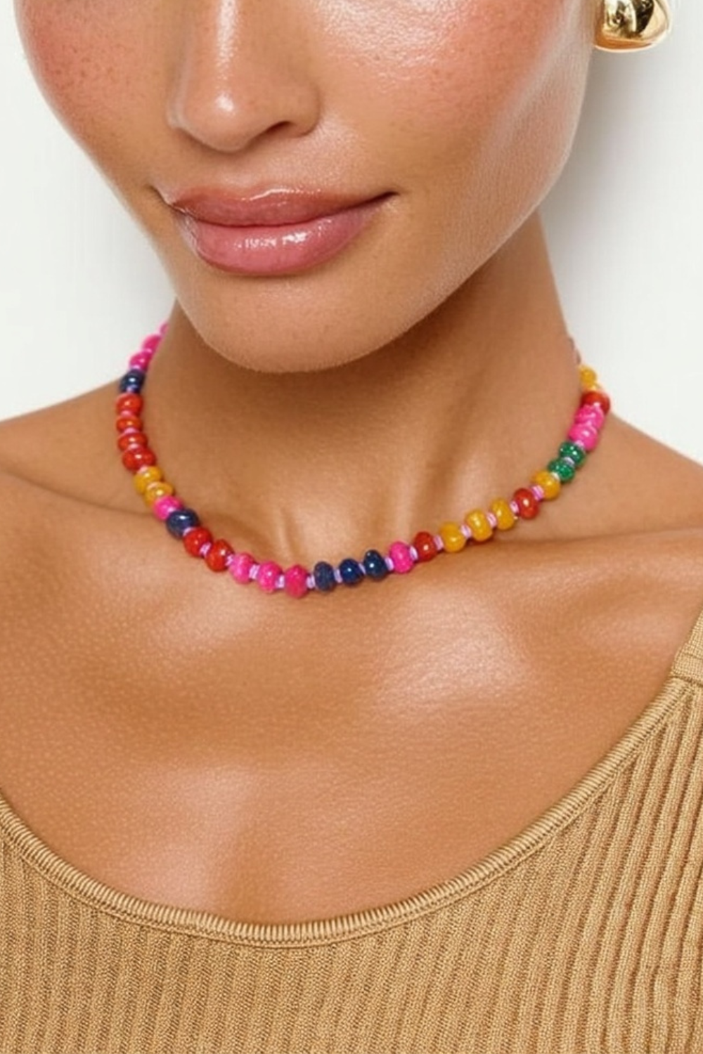 Model wearing the Marina Necklace – 14k yellow gold-plated chunky beaded necklace with high-gloss natural stone beads in vibrant pink, orange, and yellow tones.