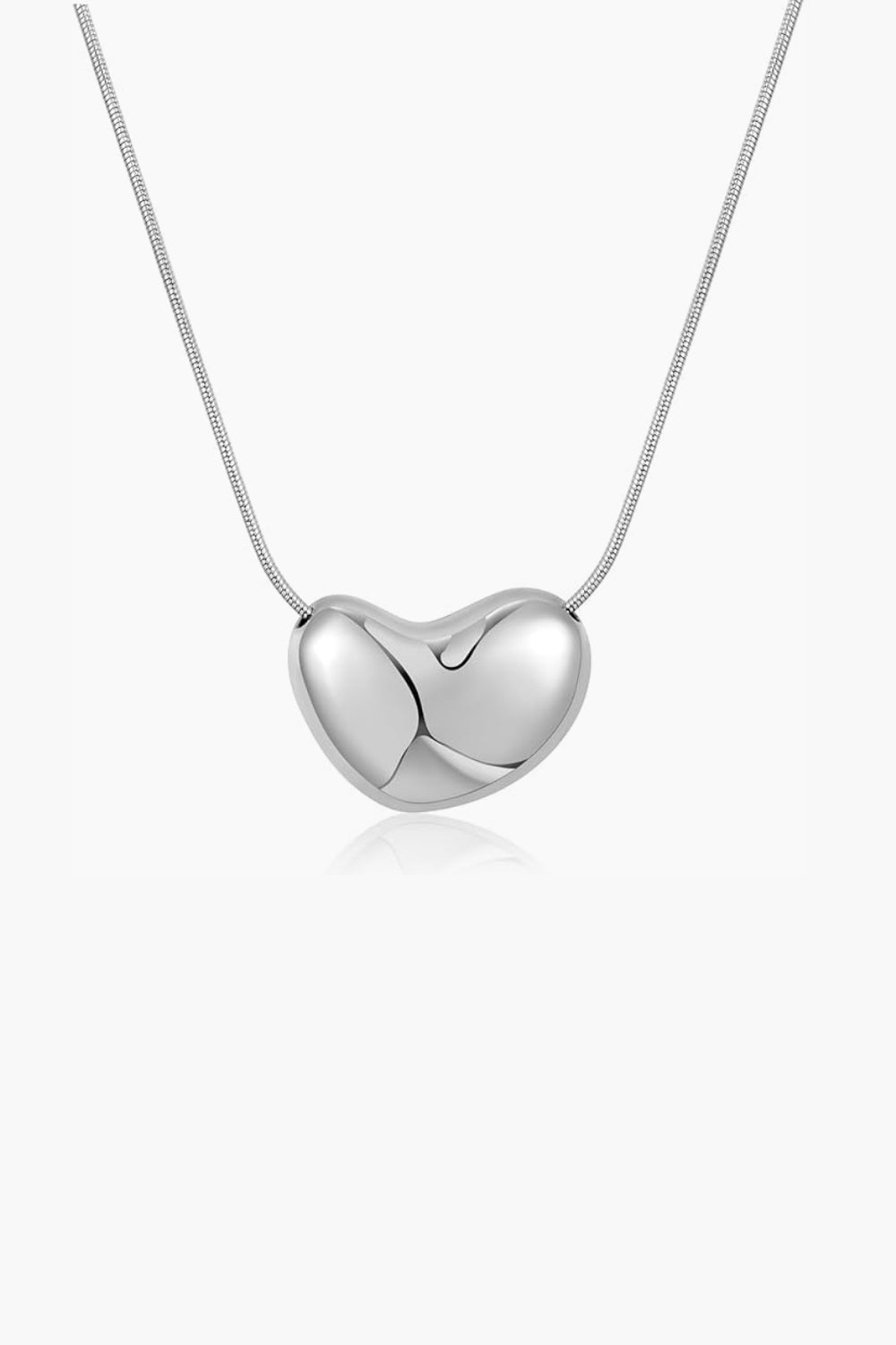 white gold abstract heart-shaped bean pendant on chain against a white background