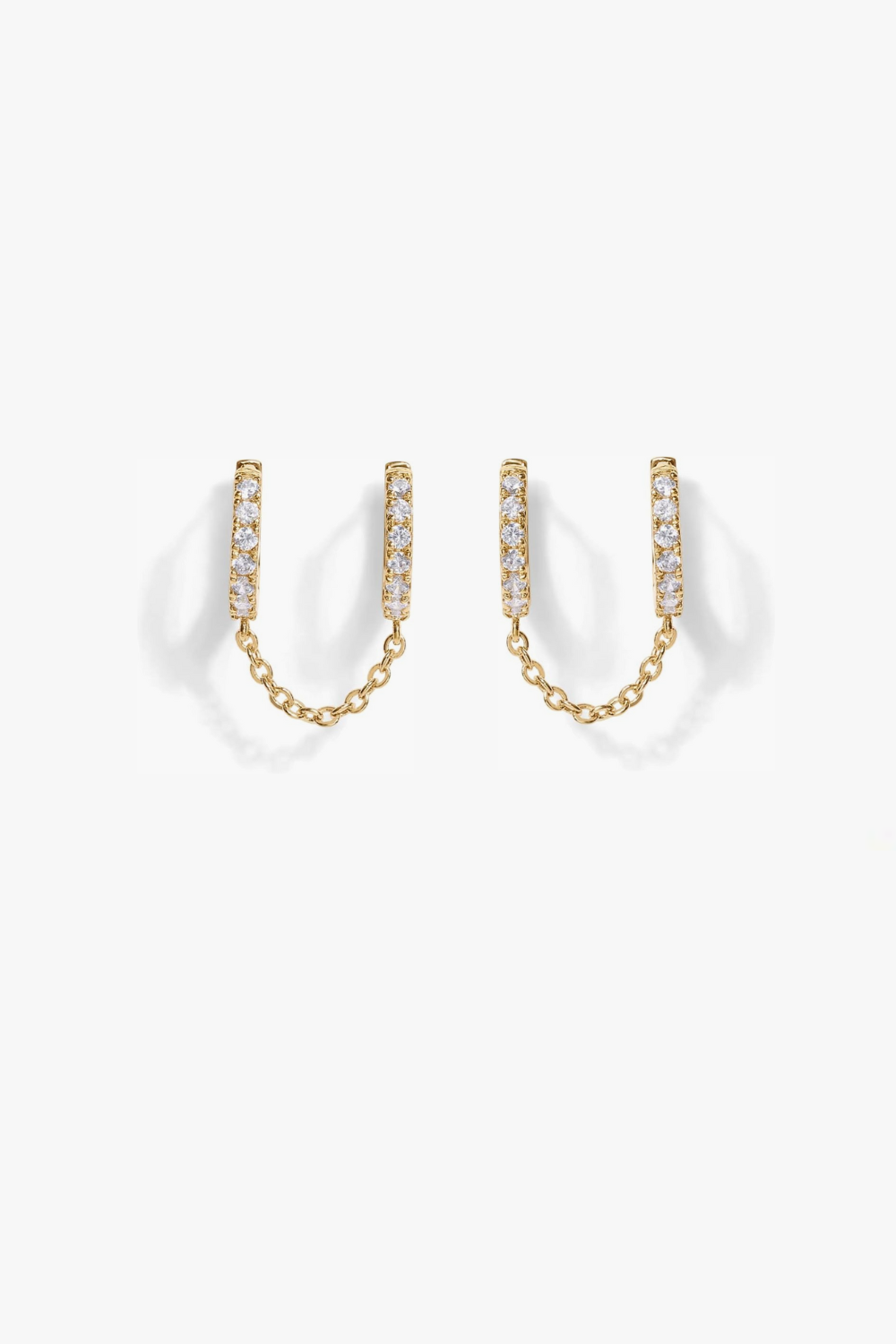 Nellie yellow gold pavé hoop earrings with slim chain. 