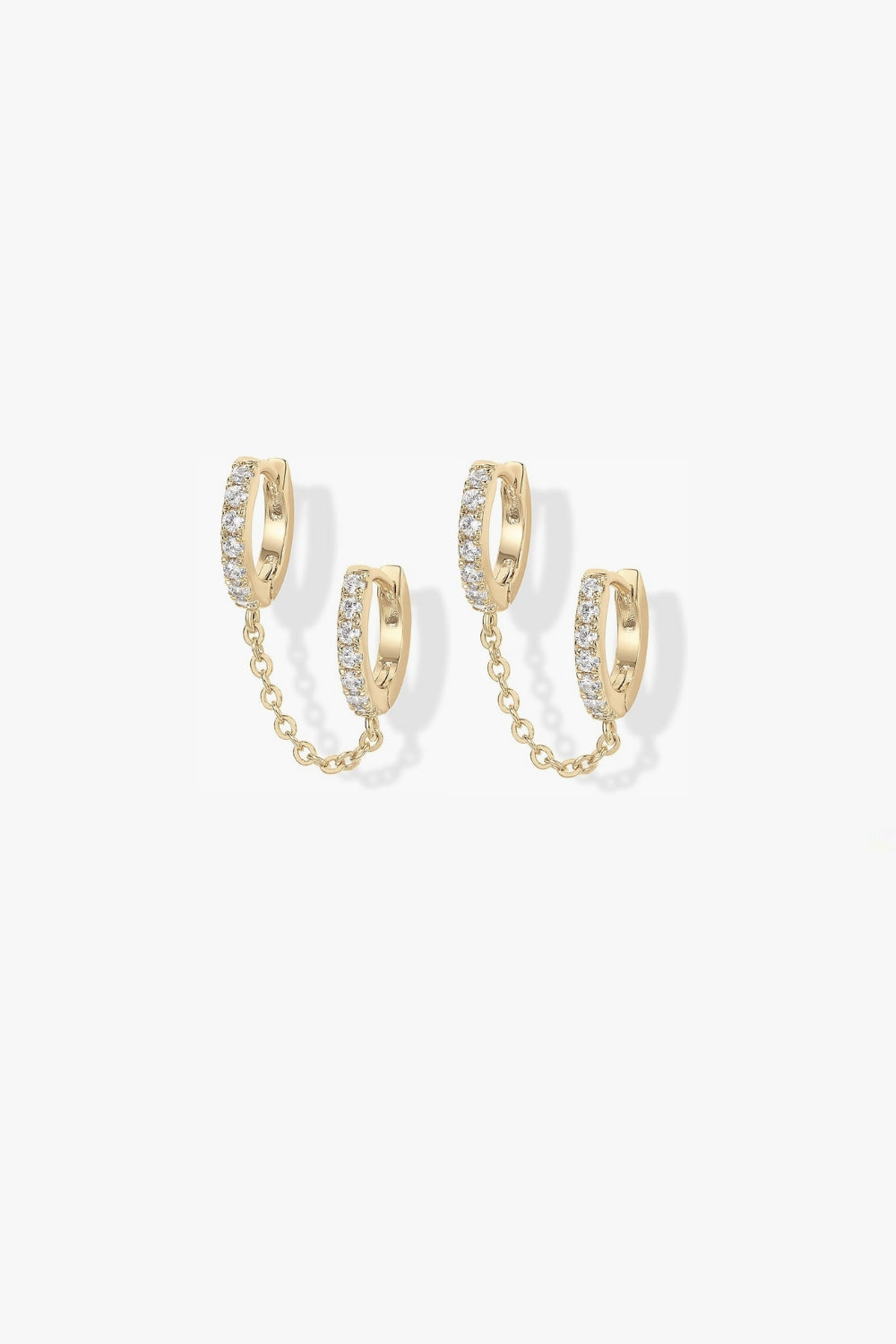 Nellie yellow gold pavé hoop earrings with slim chain.