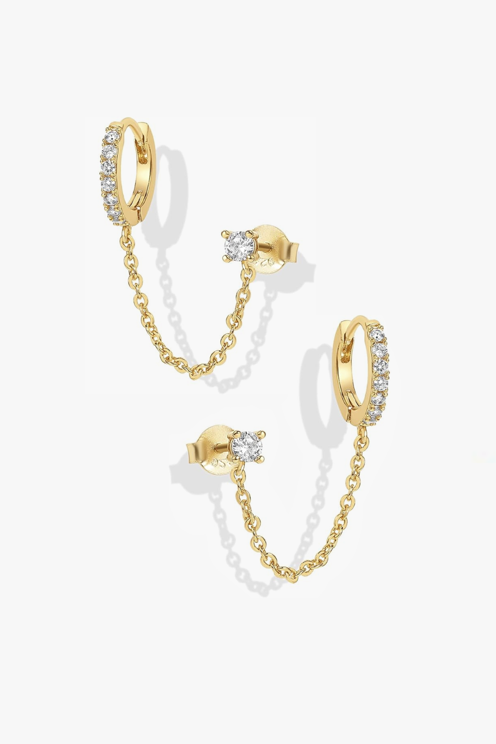Nicole yellow gold huggie earrings with stud and chain.