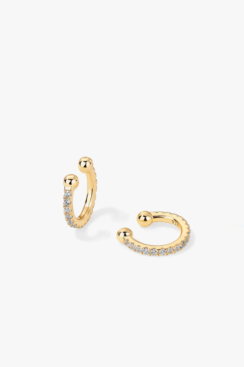 Paige yellow gold adjustable hoop pavé ear cuff with slender curved design.