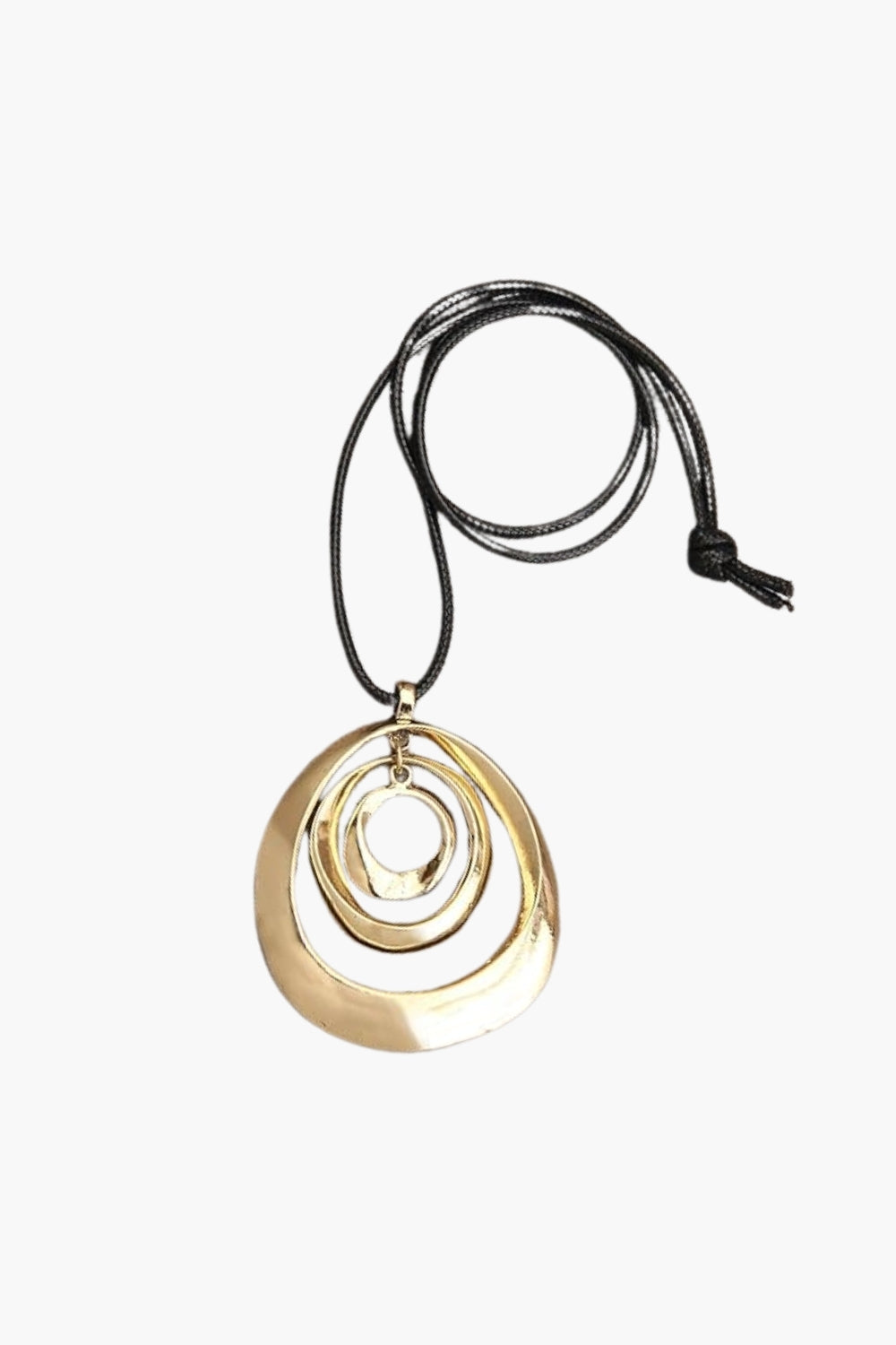 Yellow gold necklace with circular pendant and black cord on a white background.