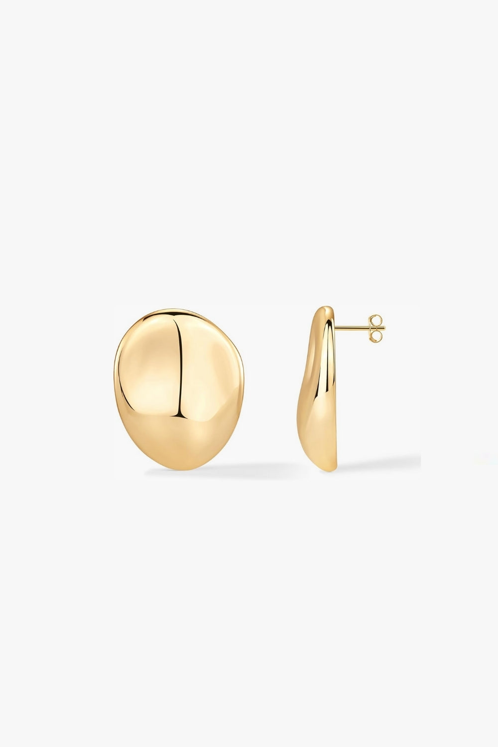 pair of textured, abstract round earrings in yellow gold on white background.