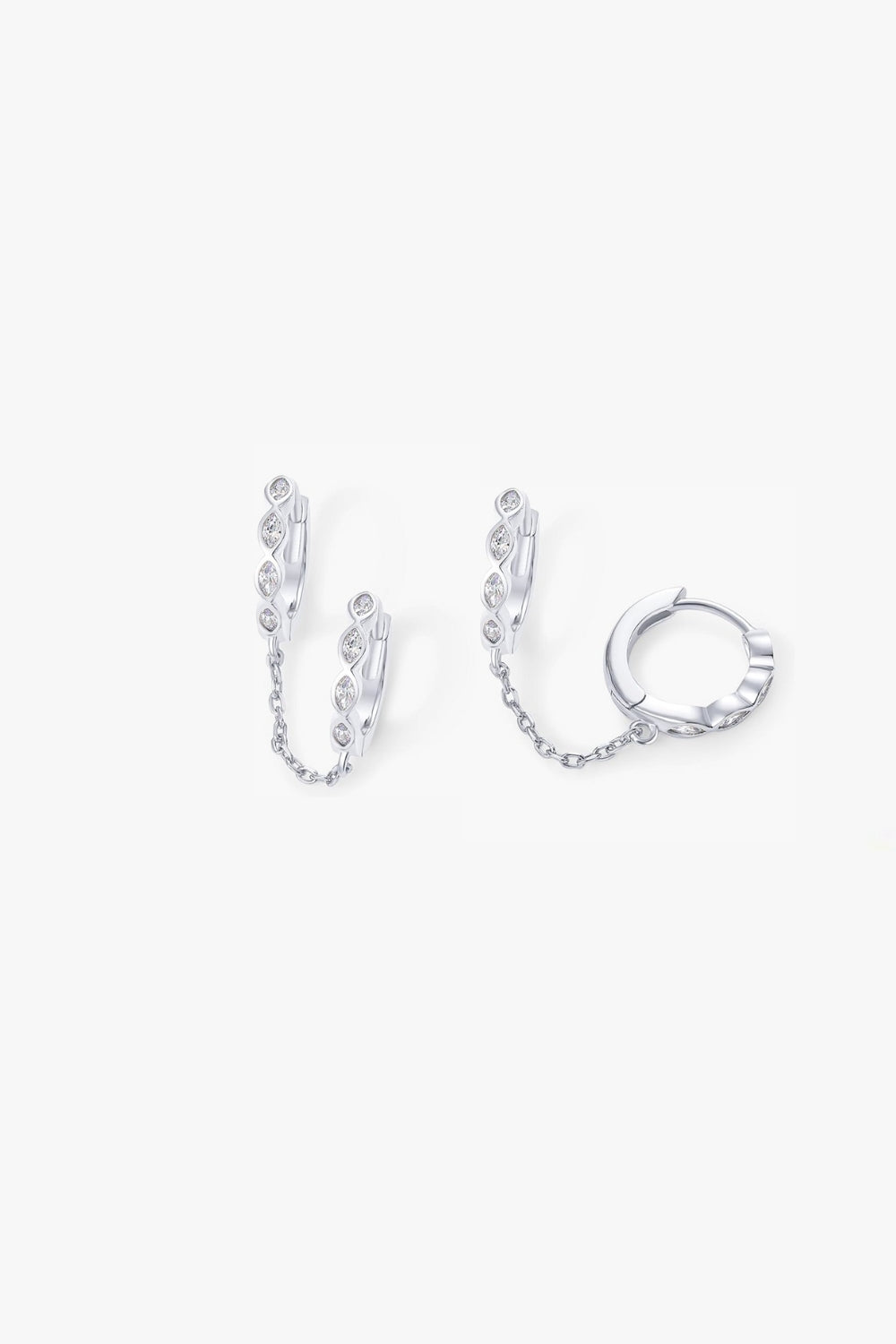 Selena white gold marquise huggie earrings linked by chain.