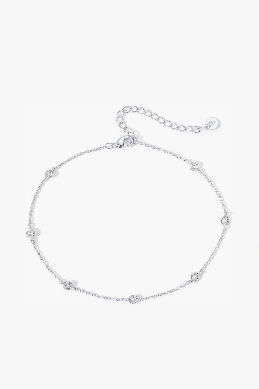 Serena Anklet – delicate 14k white gold-plated chain anklet with soft shimmering stations on white background.