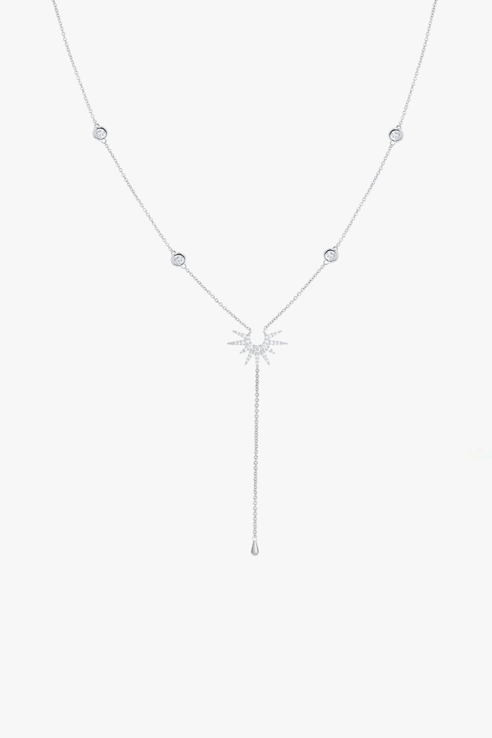 Stella white gold lariat necklace with four bezel set stones and starburst pendant.