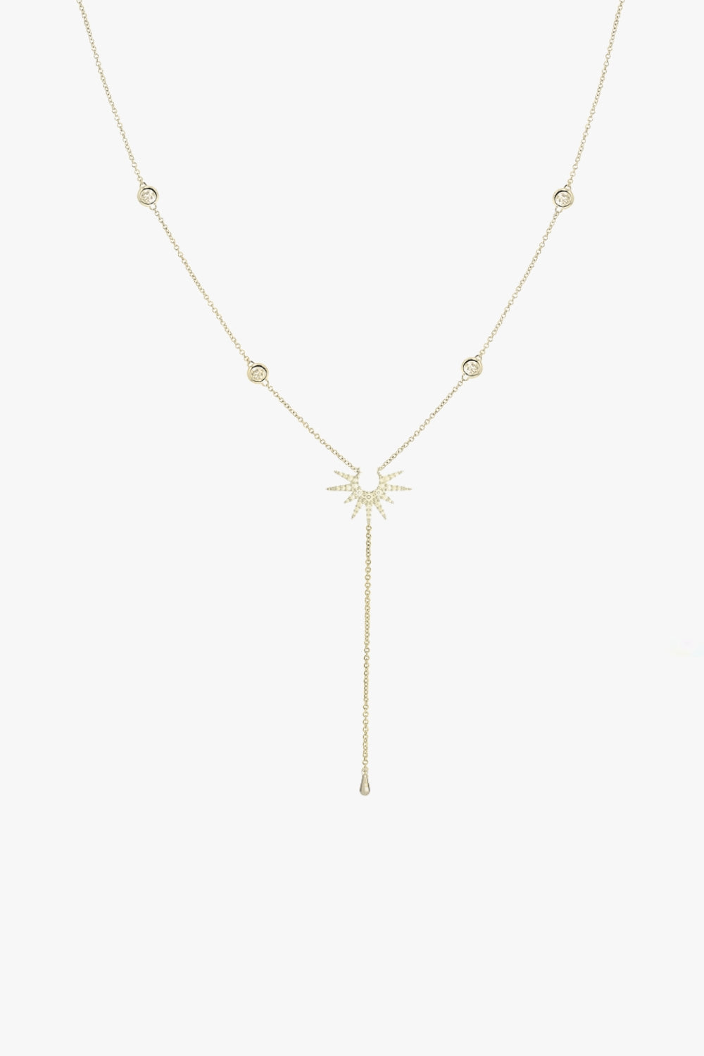 Stella yellow gold lariat necklace with four bezel set stones and starburst pendant.