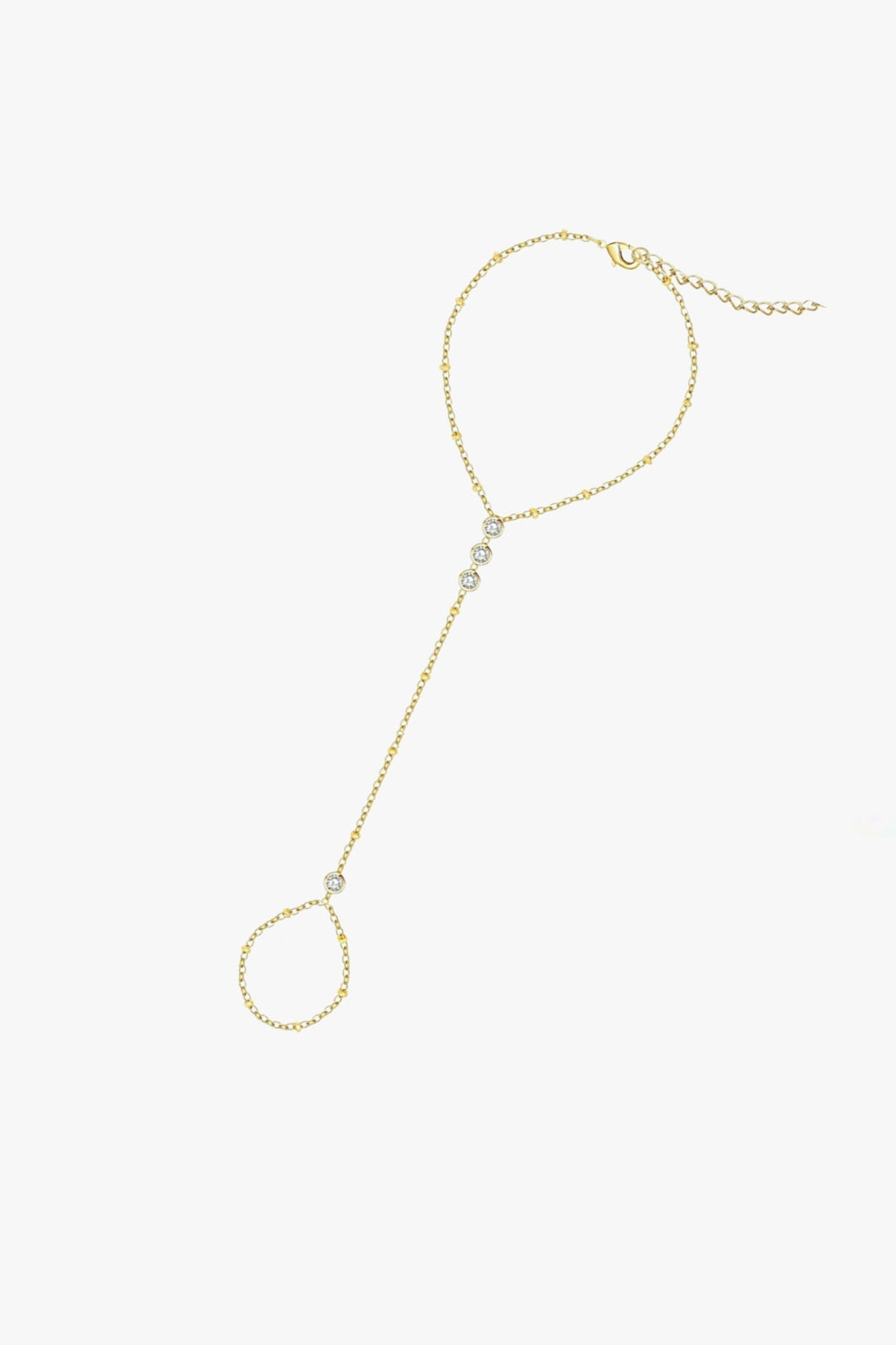Tali hand chain bracelet in yellow gold, featuring bezel-set stones, delicate finger loop, and adjustable clasp.
