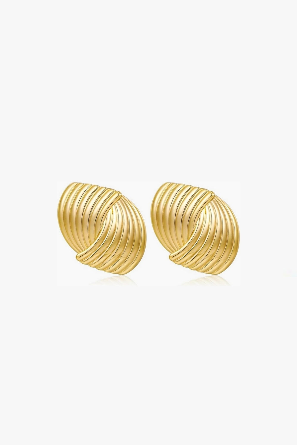 Pair of yellow gold vintage, ribbed stud earrings on a white background